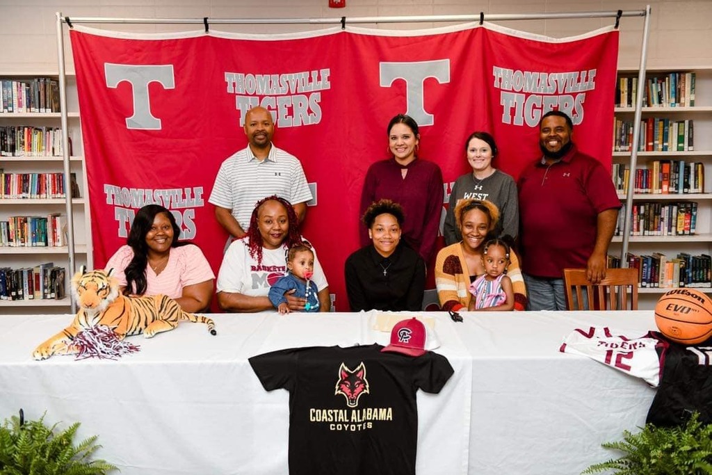 Pictured are (standing) Cedric Yelding, head women's basketball coach at Coastal Alabama Community College; Ashley Snow, THS head girls basketball coach; and THS assistant coaches Carmen Maness and Lakendrick Howard; (seated) sister Jamesha Huff, mother Tonya Banks, niece Ari Dixon, Jalisa Huff, sister Tiyanna Blanks, and niece Ava Dixon.